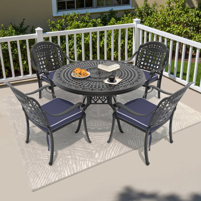 Selmner 47.24 -inch Round Table Cast Aluminum Outdoor Dining Set with Umbrella Hole and Blue Cushions