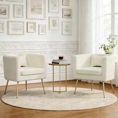 Fauteuil demi-tonneau rembourré en velours avec pieds en métal