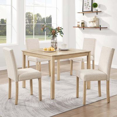Four-Seater Five-Piece Wooden Dining Furniture Package, Complete with one dinner table and four supporting chairs. Light oak finished wooden dining se