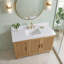 Meuble-lavabo autoportant de 48 po avec lavabo simple, fabrication en bois massif, comptoir en pierre blanche de Carrare, 6 tiroirs en queue d'aronde et 3 portes à fermeture en douceur dans un café clair