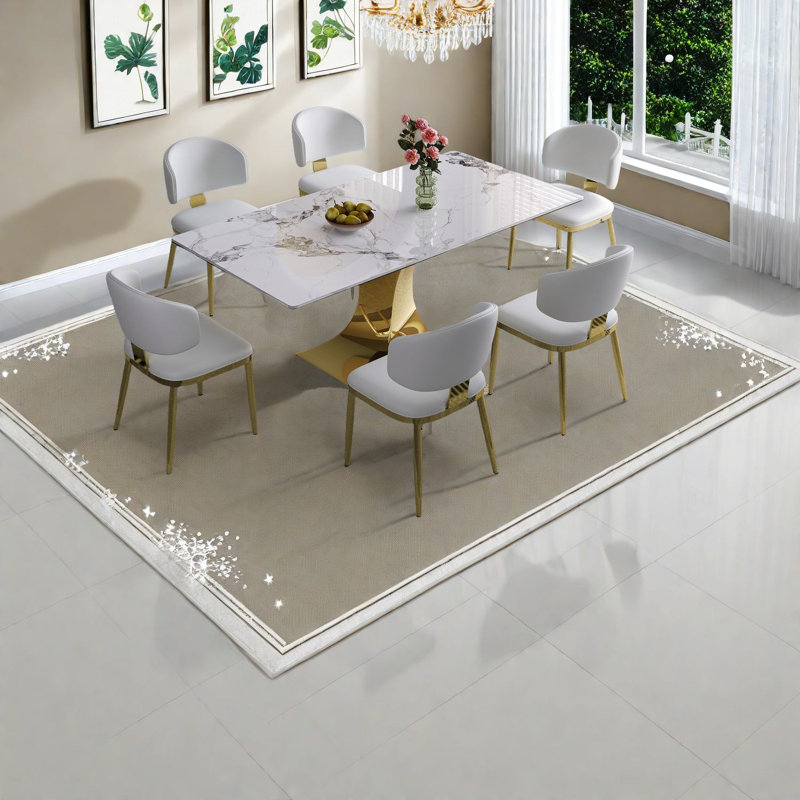 Ensemble de table de salle à manger moderne avec base plaquée or, surface en pierre frittée, idéal pour la cuisine à domicile