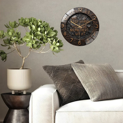 Horloge murale en bronze Motivation
