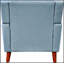Fauteuil de style Mid-Century moderne avec pieds évasés et revêtement capitonné, parfait pour des sièges élégants et confortables dans tout espace de détente.-252555259