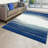 Rifiki Abstract Blue/Cream Area Rug-582808937