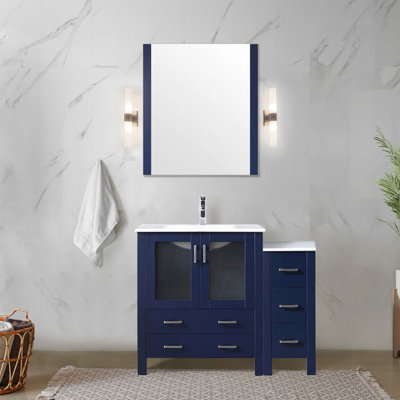 Meuble-lavabo simple bleu marine de 107 cm de large avec armoire latérale, comptoir en céramique blanche, structure en bois massif, mécanisme de fermeture amortie, un placard et cinq tiroirs de rangement, comptoir résistant aux rayures.