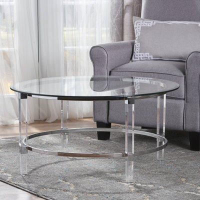 Table basse ronde en verre trempé transparent avec apparence aérée, chic, translucide et pied élégant