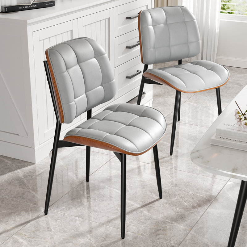 PU Leather Upholstered Dining Chairs With Stitched Detailing And Soft Padding - Perfect Side Chairs For Dining Rooms, Kitchens, And Living Rooms.