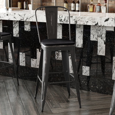 Tabouret à hauteur de comptoir toutes saisons avec siège en résine polyester Brinya