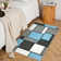 Tapis bleu délavé à motif géométrique lavable