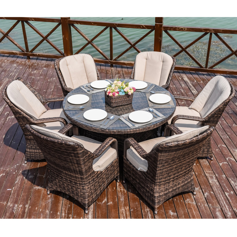 Algird 6 - Person Wicker Patio Dining Set with Round Table , Cushions Included, Beige, Brown
