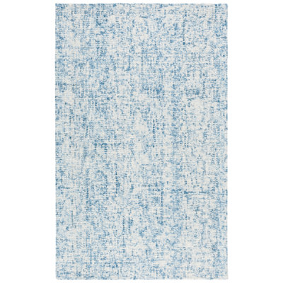 Geline Abstract Hand Tufted Wool/Cotton Abstract Rug in Blue/Ivory