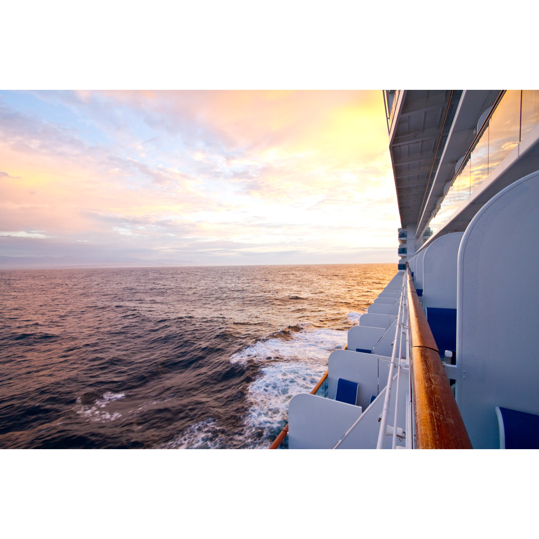 Side View Of Cruise Ship At Dusk von Grandriver - No Frame Set auf Leinwand