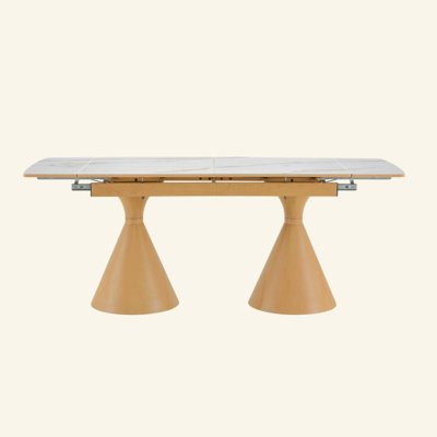 Extendable Stone-Top Dining Table: White marble-patterned tabletop with tapered metal legs. A modern, luxury-inspired rectangular dining table for hom