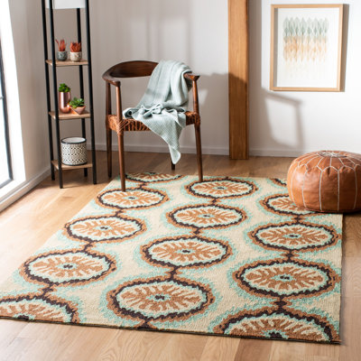 Tapis d'intérieur / extérieur à motif floral brun et bleu crocheté à la main Puri