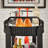 Mcmullen Black Finish Metal Oval Bar Cart With Clear Tempered Glass