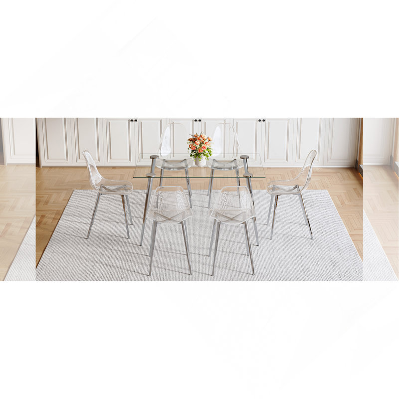 Ensemble de table et de chaises. Ensemble de table de salle à manger moderne et luxueux en verre trempé rectangulaire avec 6 chaises en plastique transparent avec pieds en métal argenté. Apportez une expérience de maison confortable à la cuisine.