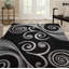Tapis noir à motif abstrait Adonia-129021881