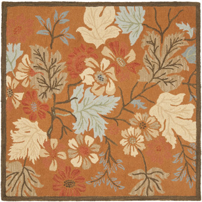 Emrick Hand Hooked Wool/Cotton/Latex Floral Rug in Orange