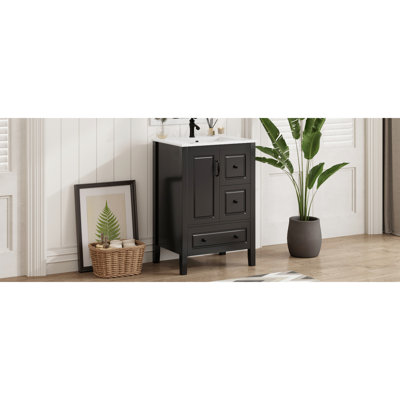 Meuble-lavabo noir vintage de 61 cm (24 po) avec lavabo en céramique prépercé, rangement à fermeture douce et poignées de style rétro. Système autoportant nécessitant peu d'entretien.