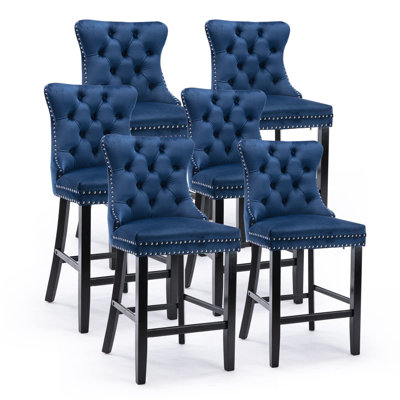 Tabouret de bar rembourré en velours avec dossier capitonné