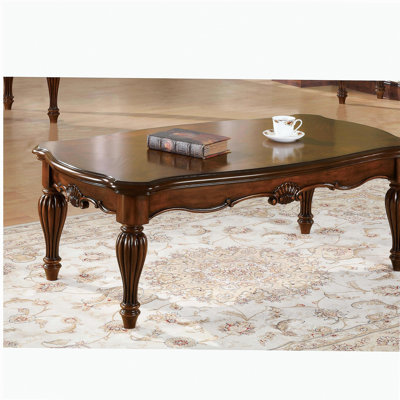 Table basse cerise rectangulaire, pieds tourbillonnants