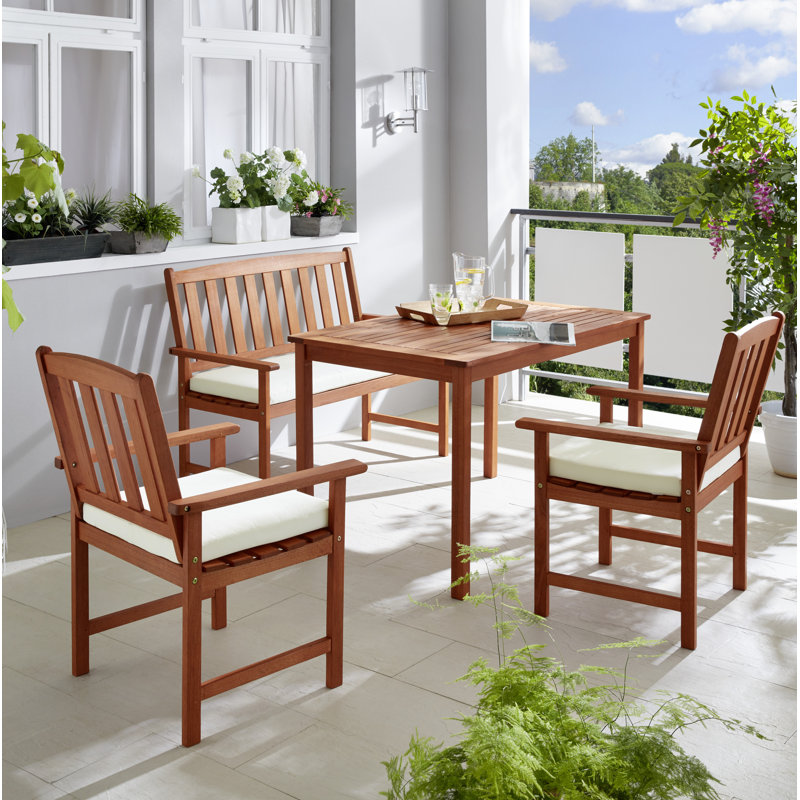 France 4 - Person Wood Patio Dining Set with Rectangular Table , Cushions Included