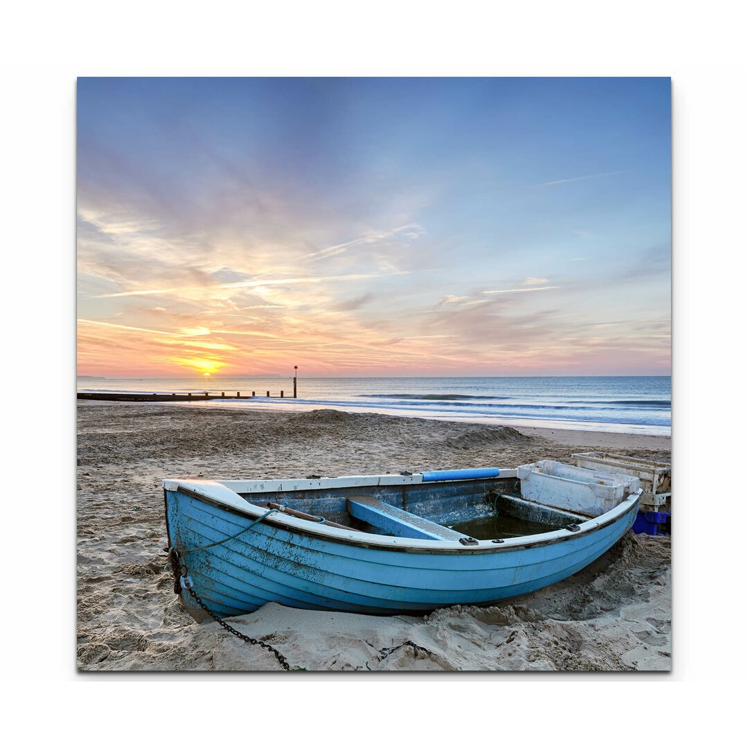 Leinwandbild Türkisblaues Fischerboot bei Sonnenaufgang