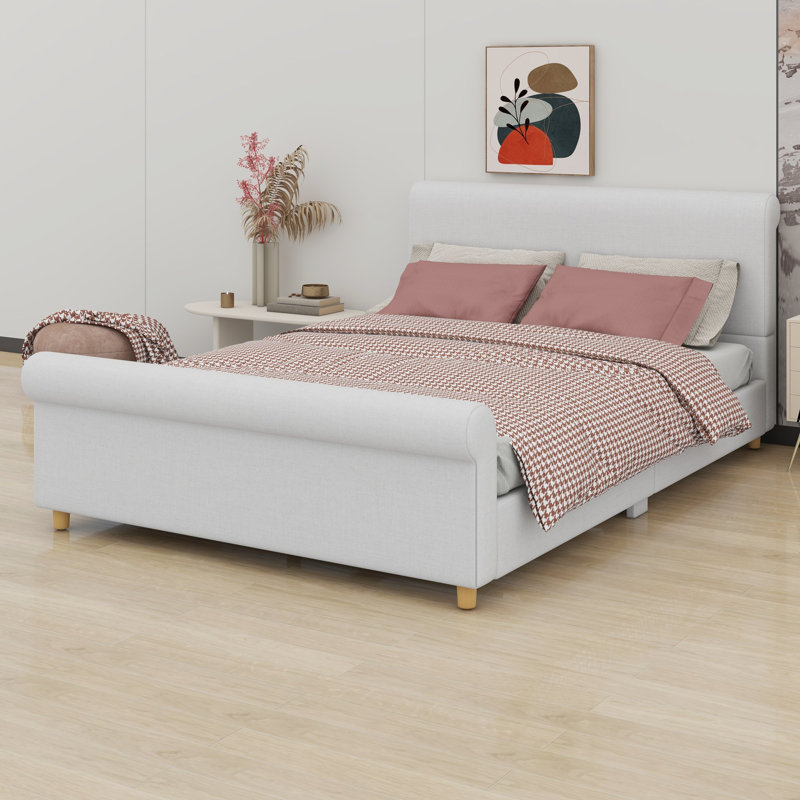 Platform bed frame with classic sleigh silhouette and high headboard anchors traditional bedrooms, Queen