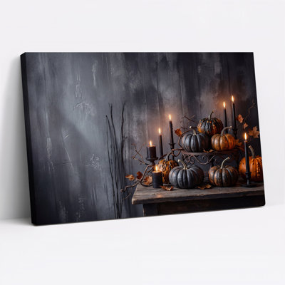Art sur toile, citrouilles noires et orange avec bougies allumées