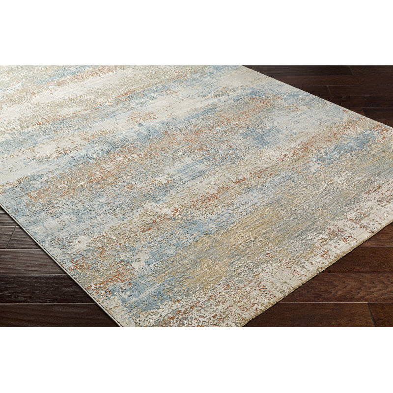 Tapis bleu / rouille / beige / gris en polypropylène tissé à la machine à motif abstrait Avia