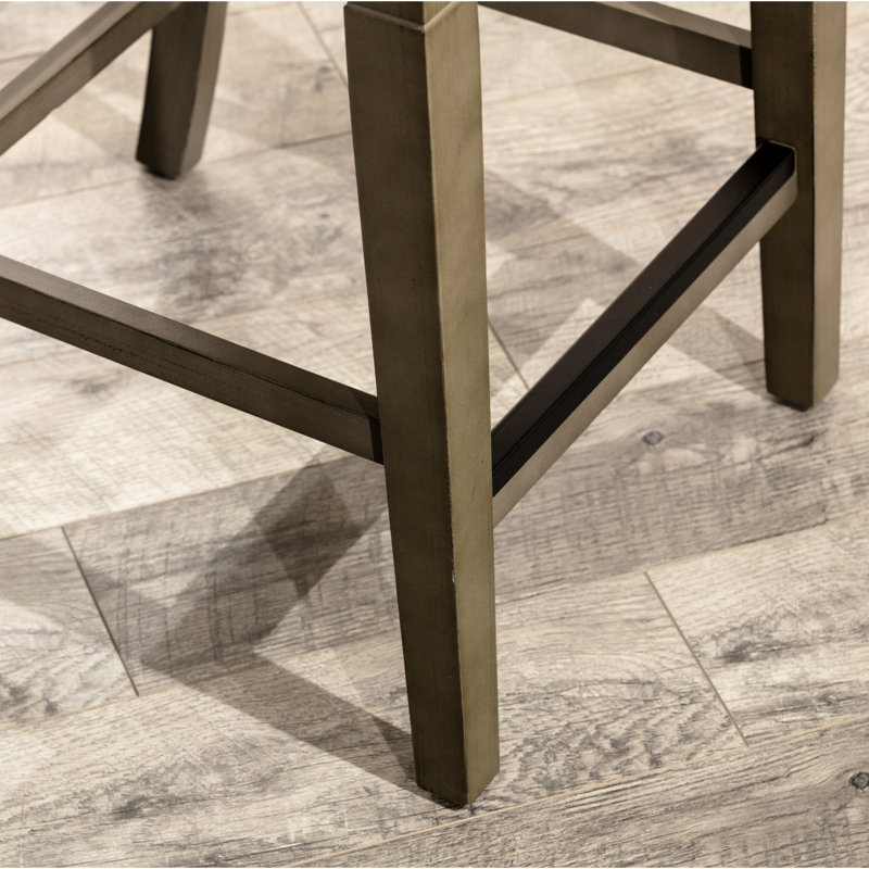 Tabouret de comptoir au fini gris patiné, siège en cuir français avec dossier confortable