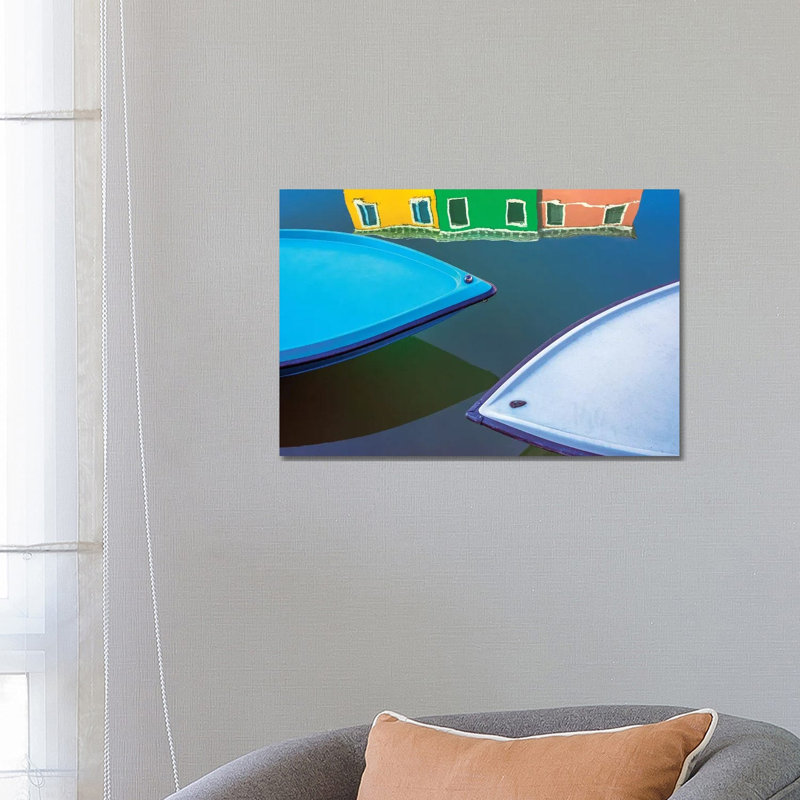 Italy, Burano. Boat Bows And House Reflection In Canal. by Jaynes Gallery - Wrapped Canvas Print