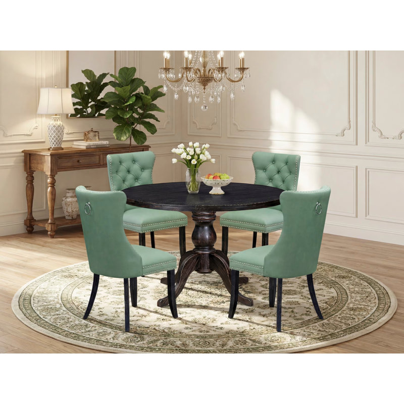 L'ensemble de salle à manger 5 pièces comprend une table ronde de 48 po avec piédestal et 4 chaises rembourrées en tissu de polyester vert saule, noir sablé