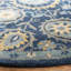 Tapis bleu en laine touffeté à la main Dipietro-26830941