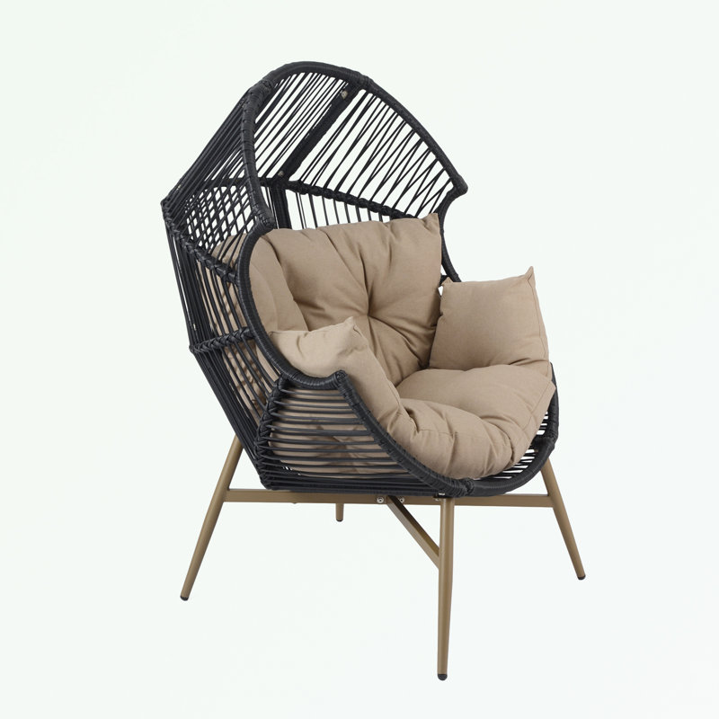 Fauteuil ovale en osier avec coussin