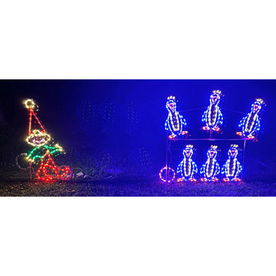 Animated Elf Bowling with Penguin Pins Holiday Lighted Display