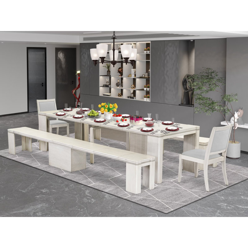 L'ensemble de table de salle à manger 5 pièces comprend une table de cuisine rectangulaire extensible, 2 chaises empilables en polyester et 2 bancs modernes, blanc antique