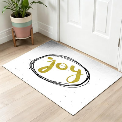 Tapis intérieur noir lavable à la machine, avec calligraphie manuscrite et détails dorés