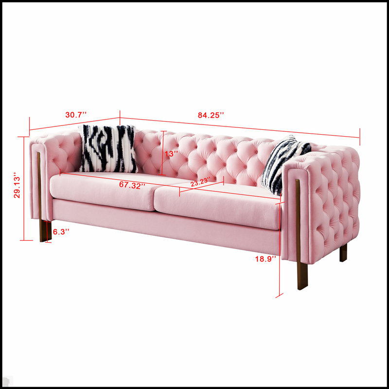 Canapé moderne en velours avec dossier capitonné et structure durable, parfait pour le confort et le style de tout espace de vie.