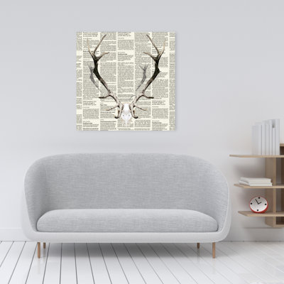 Toile rustique avec des animaux bruns | Cornes de cerf sur un décor de journal