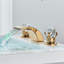 Robinet de lavabo pour salle de bain espacé à 2 lumières en or