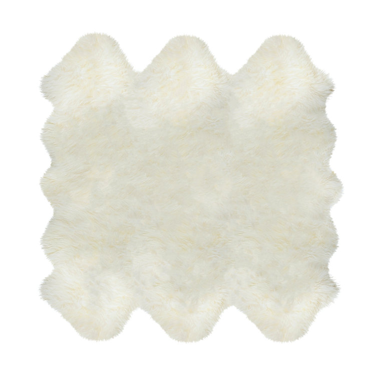 Novelty Colello Solid Color Handmade Sheepskin 5' x 6' Area Rug in Natural
