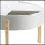 Table basse élégante et fonctionnelle avec rangement caché, idéale pour les espaces de vie modernes