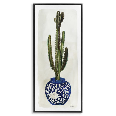 Cactus dans un vase orné de plantes bleues
