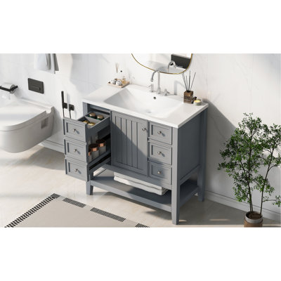 Meuble-lavabo de 36 po Valverde équipé d'un lavabo en céramique arrondi blanc, d'une armoire à une porte, de trois séparateurs réglables à tiroirs, de peuplier massif et de planches, finition grise, conception autoportante, encastré simple