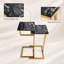 Ensemble de table carrée 2 pièces avec dessus en marbre noir et bases dorées pour espaces de vie