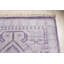 Tapis mauve en laine noué à la main
