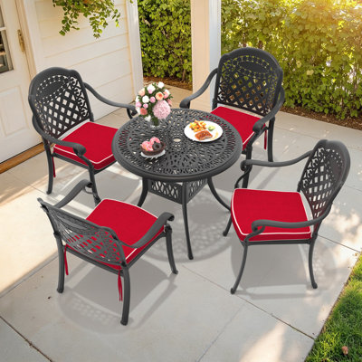 Ensemble de salle à manger d'extérieur 5 pièces en aluminium moulé, table ronde de 90 cm avec trou pour parasol et 4 chaises empilables avec coussins rouges
