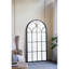 Miroir arqué noir et or de 34 po x 65,5 po de long, complément aux éléments décoratifs du salon dans la chambre à coucher