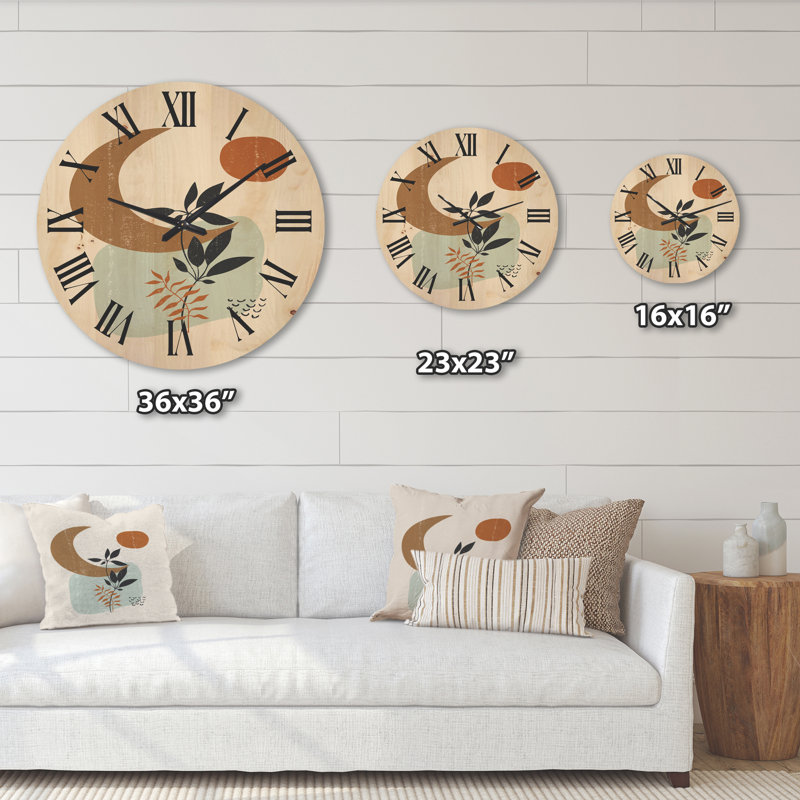 Horloge murale abstraite soleil et lune avec un minimum de plantes, Grand